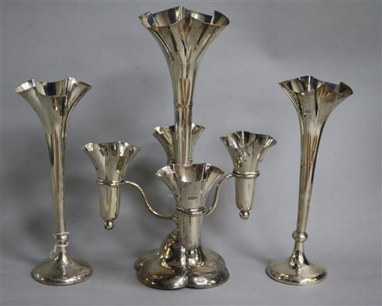 A pair of Edwardian silver posy vases and an Edwardian silver epergne, (a.f.) all pieces loaded.